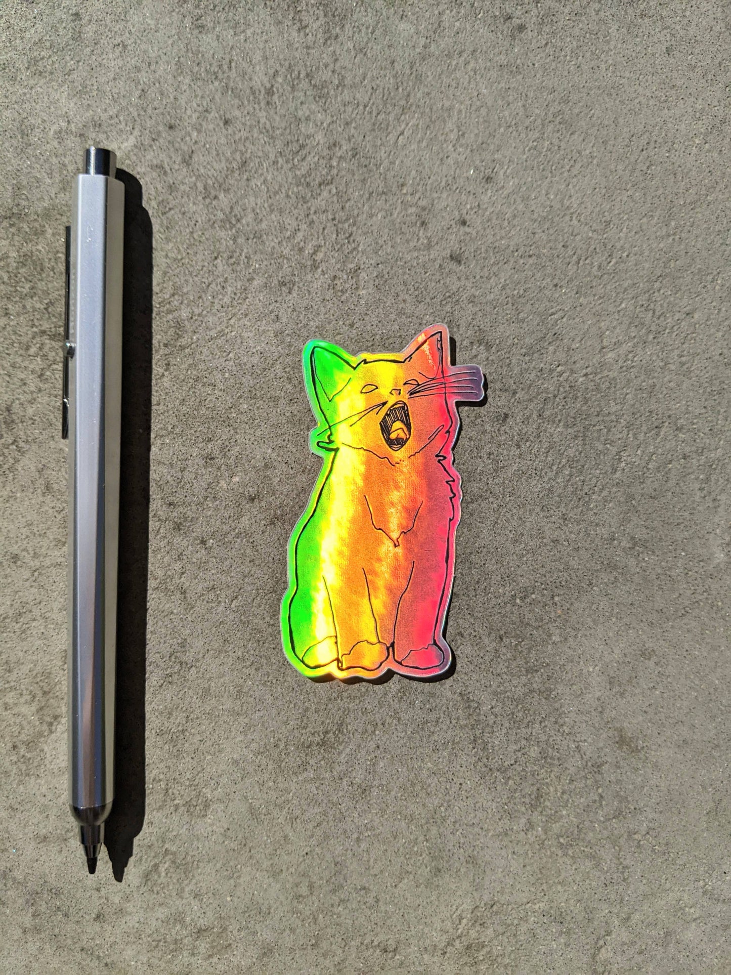 Holographic yawning kitten sticker.