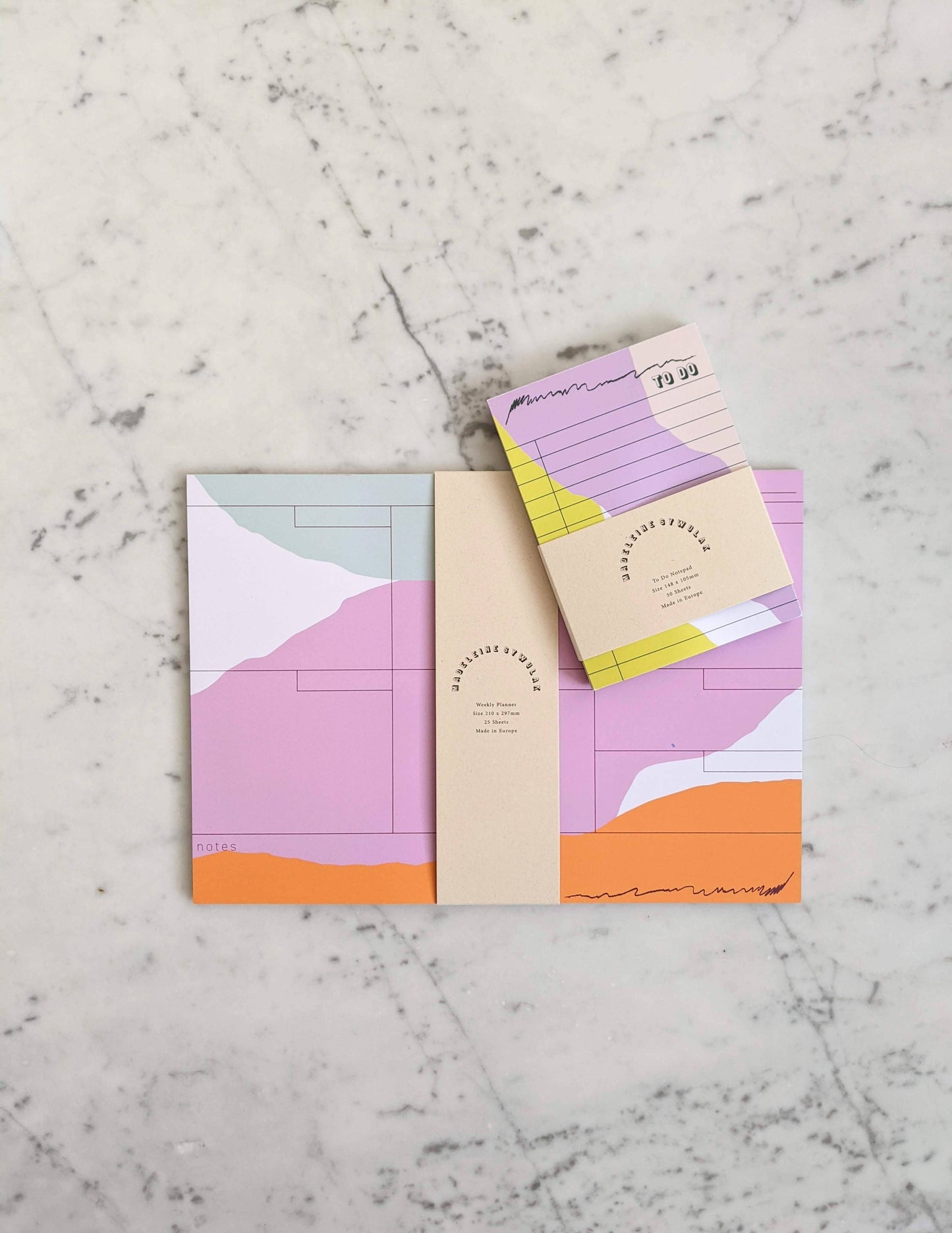 25 sheet weekly planner in mint, mauve and pumpkin with to-do notepad.