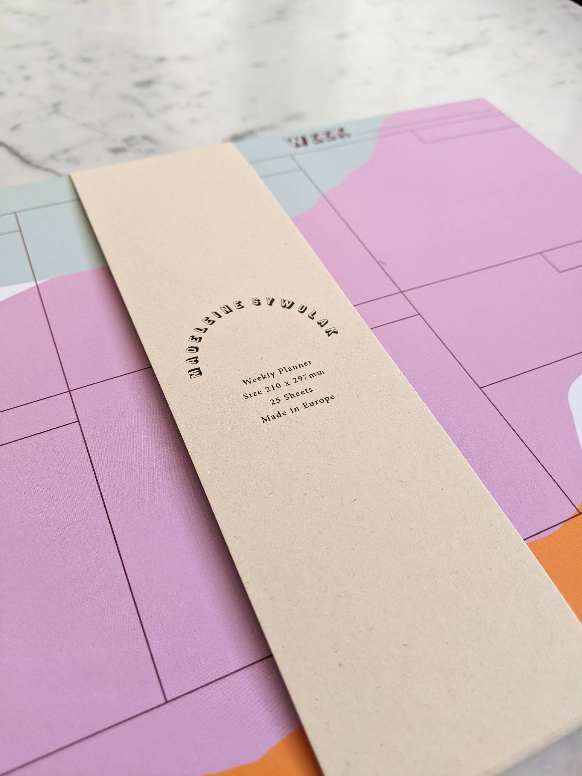 25 sheet weekly planner in mint, mauve and pumpkin.